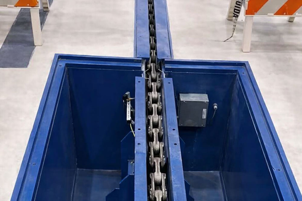 jervis-b-webb-webbspain-daifuku-transporte-industrial-cadenas-arrastre-suelo-automatizado